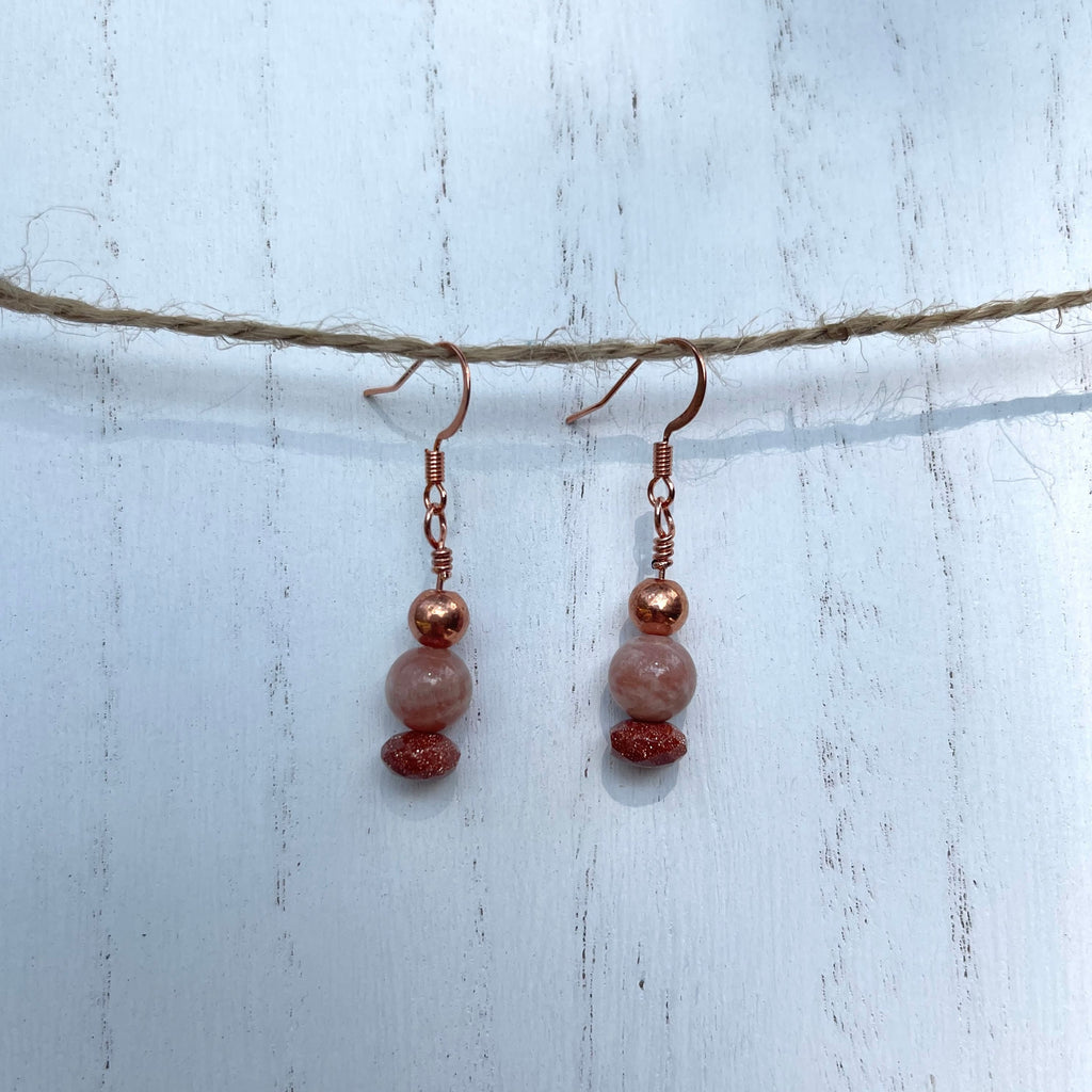 Handcrafted wire wrapped earrings with copper. Sunstone, goldstone, and copper beads