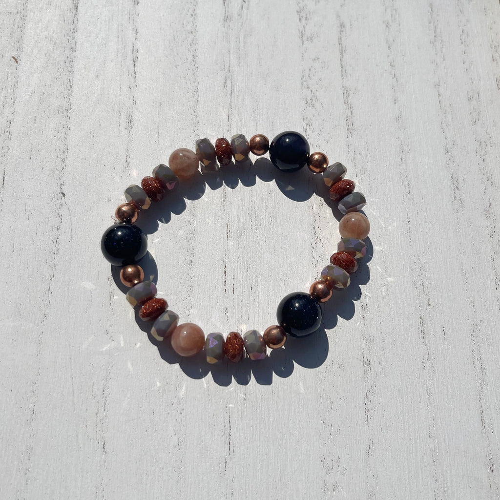 Handcrafted stretch bracelet on Professional Stretch Ninja Cord. Goldstone, sunstone, silverite gemstones, and copper beads