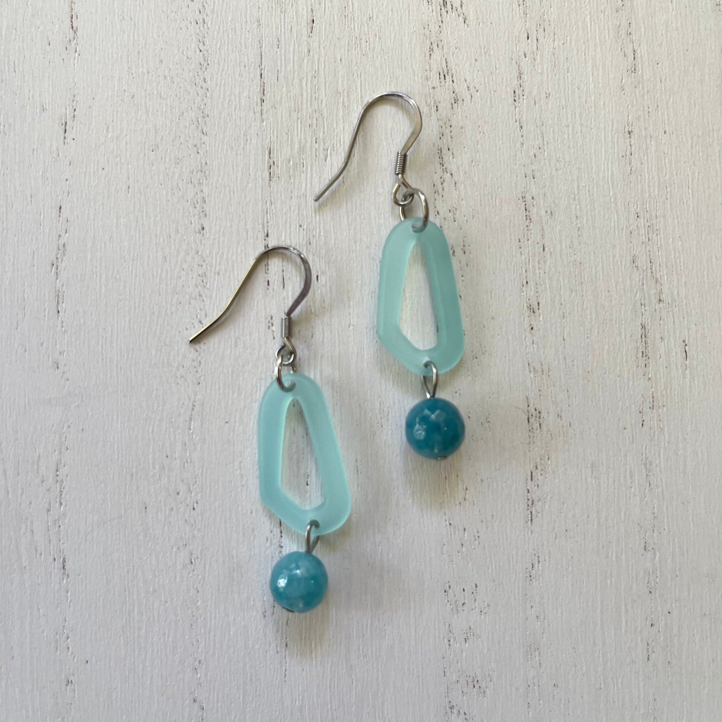 Handcrafted earrings with stainless steel earring wires and components. Agate stones and acetate shaped connector.