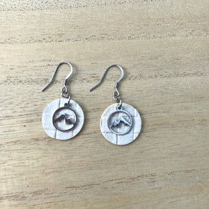 Handcrafted earrings with stainless steel wires and components. Stainless steel charm. Leather.