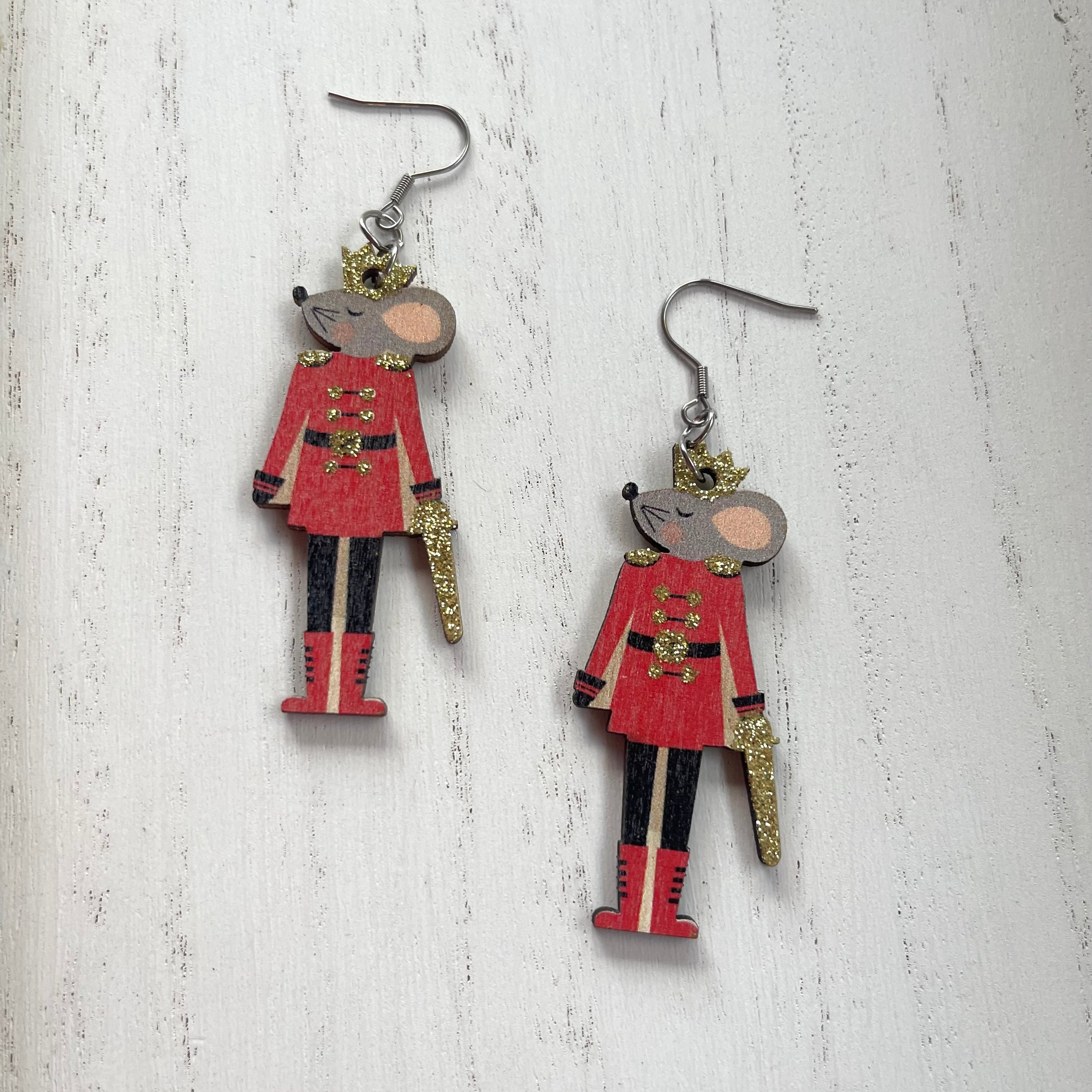 Handcrafted on stainless steel earring wires.
Wood painted mouse nutcracker cutouts.