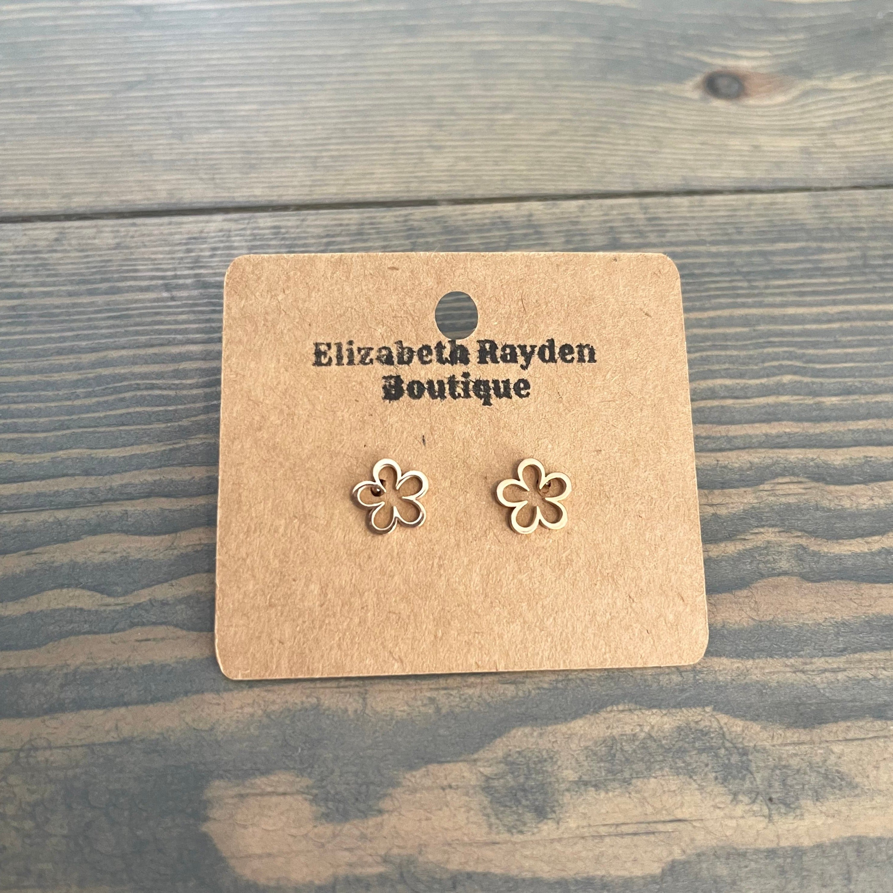 Flower outline stud earrings in stainless steel. 8mm.