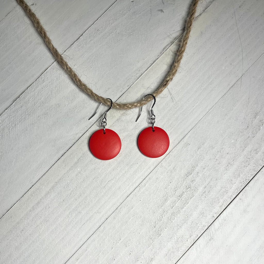 Handcrafted earrings with stainless steel earring wire and components. Red wood disc.