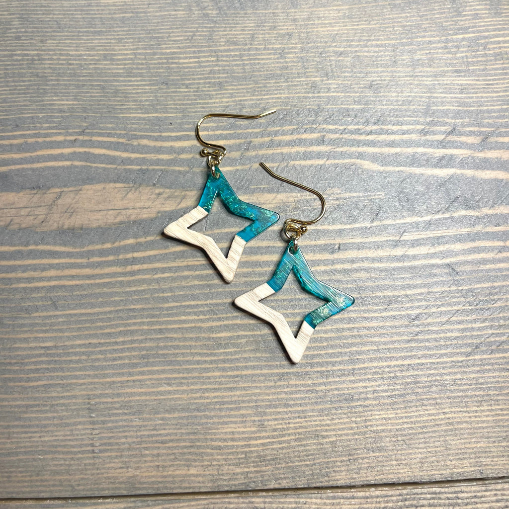 Handcrafted earrings with stainless steel earring wires and components. Wood and resin with gold flakes star charms. 