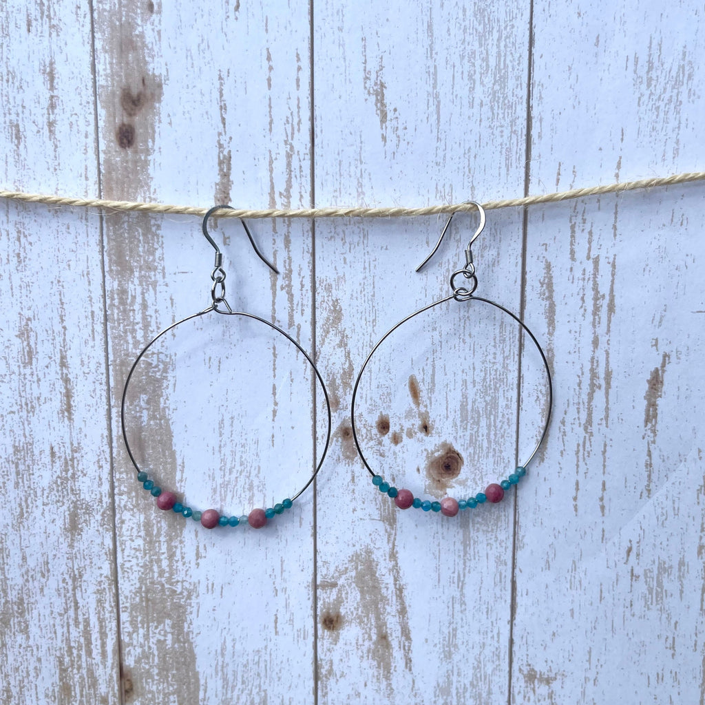 Handcrafted hoop earrings with stainless steel wires and components. Apatite and rhodonite gemstones.