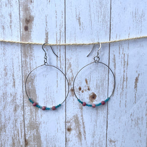 Handcrafted hoop earrings with stainless steel wires and components. Apatite and rhodonite gemstones.