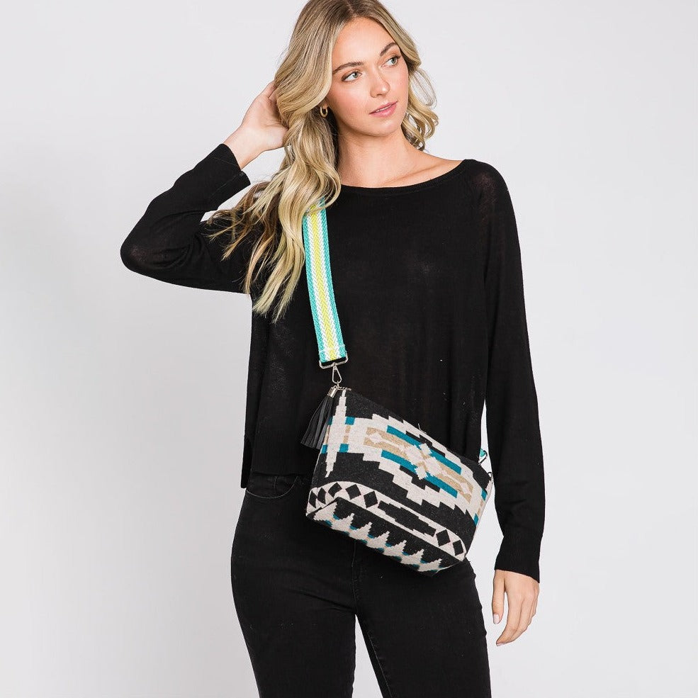 Western print crossbody bag with guitar strap and tassel details. Zipper closure. Lined with one pocket inside. Approximately 11"W X 8" T X 3" D. Adjustable / Removable strap. Strap adjustable 25-50" 100% Cotton