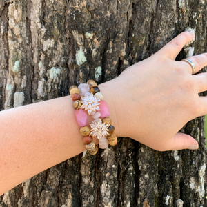 Hand crafted bracelet made on memory wire. Beaded with picture jasper, rose quarts chips, sandstone, tiger eye beads, and two flower buttons. 