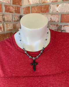 Handcrafted with all stainless steel. Approximately 21 1/2 inches at a matinee length. Glass cross pendant, hematite disk spacers, 6mm black hematite, 8mm gray glass luster beads, glass blue luster rondelles and tiny crystal accent beads.