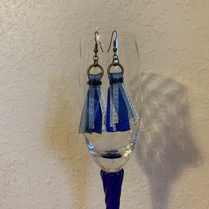 Handcrafted with ribbon and metal wire to make the tassels. All brass metal. Earring total drop length is approximately 2 1/4 inches.