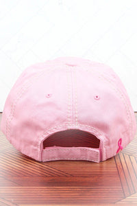 Pink distressed hat with a patch. Also has a pink ribbon stitched on the back of the hat.  100% cotton. Velcro closure.  Adjustable. One size fits most.