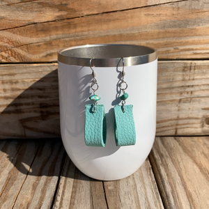 Handcrafted with all stainless steel metal. Read suede leather and real turquoise chip beads.