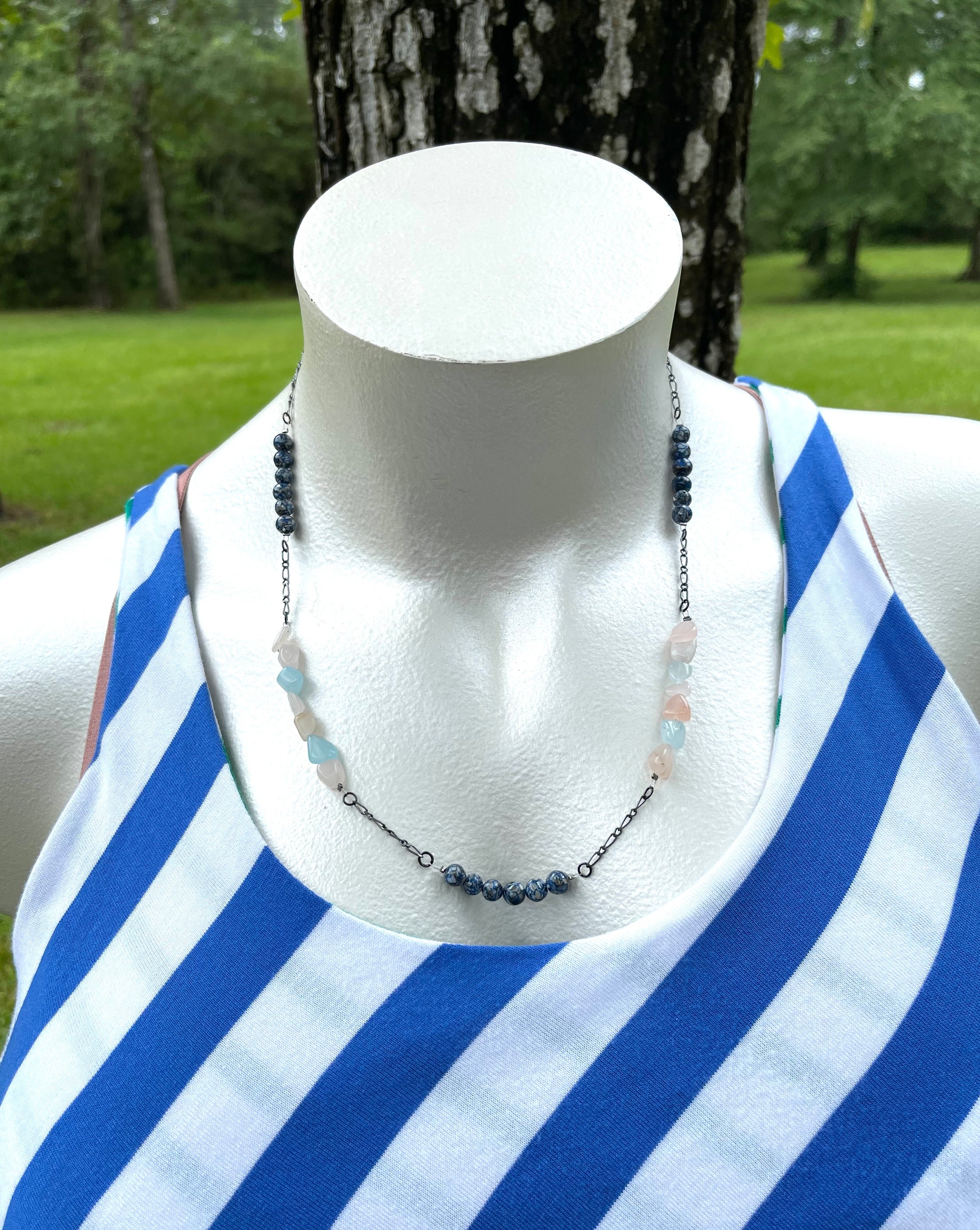 Handcrafted necklace with gunmetal chain. Morganite nugget beads, and blue reconstituted shell beads. Necklace length is 24 1/4 inches long.