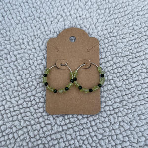 Handcrafted on 24mm silver plated hoops. Peridot chips and 3mm faceted green goldstone beads.