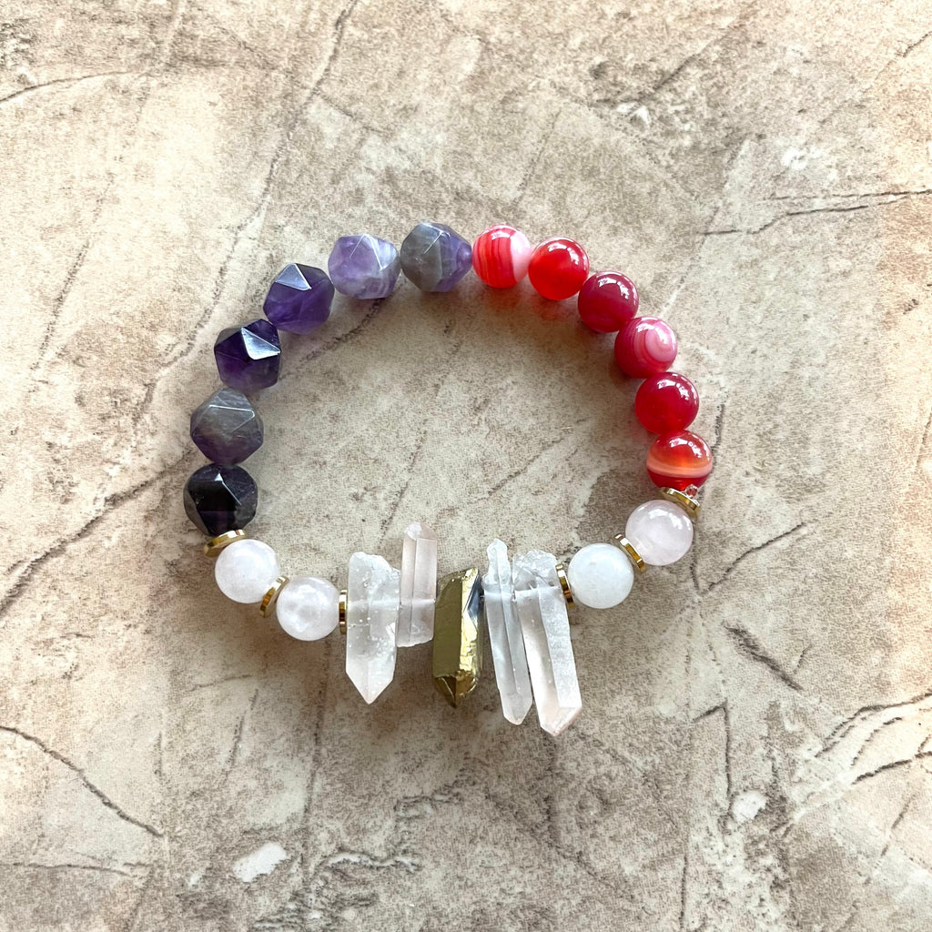 Handcrafted on Professional Strength Ninja Cord. Beaded with quartz sticks, rose quartz, amethyst, red striated agate, and gold stainless steel spacers.  