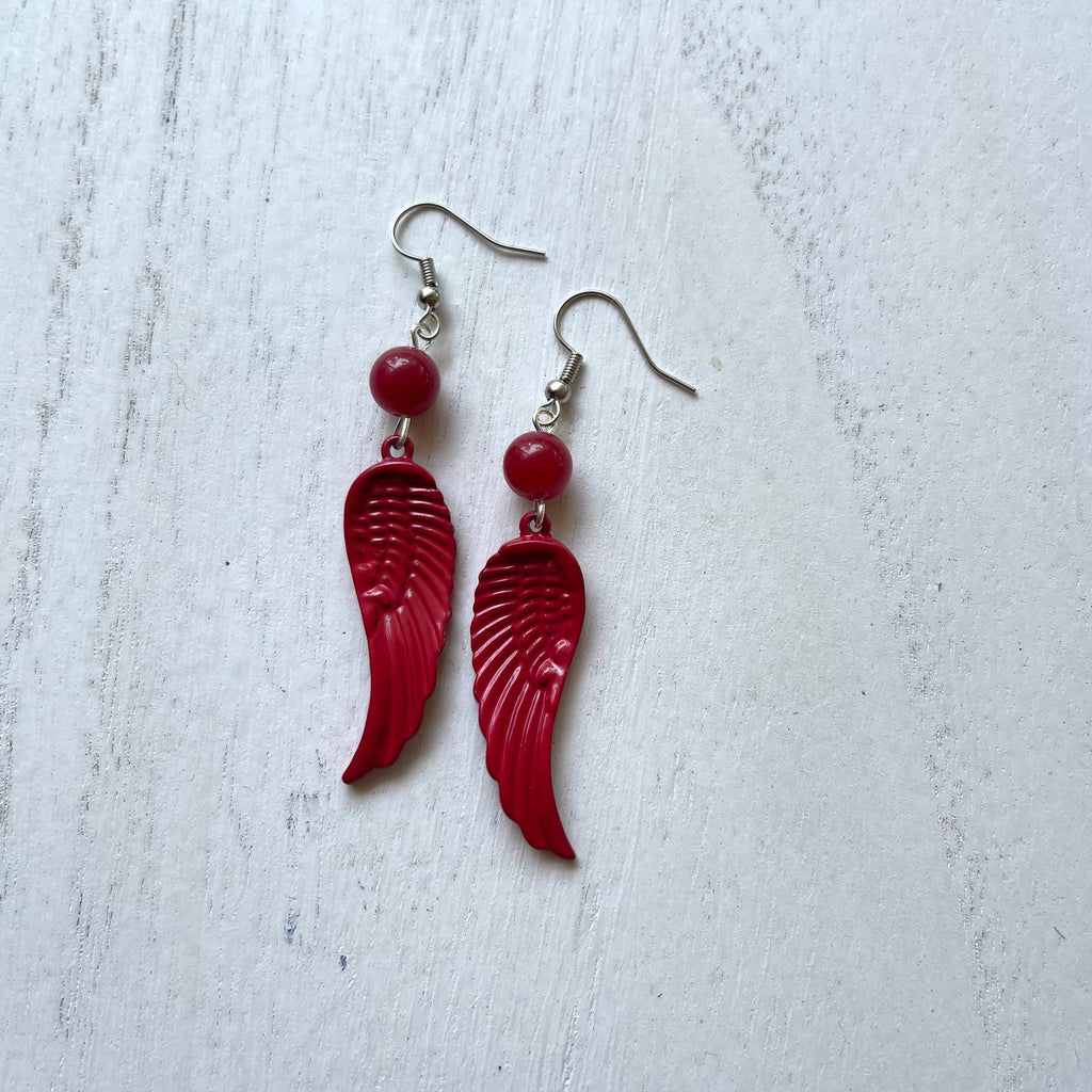 Handcrafted earrings with silver plated earring wires and components. Red striated agate stone.  Red painted metal wings.