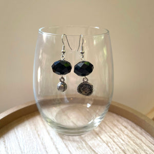 Handcrafted earrings with silver plated earring wires.  Pewter charms.  Glass beads.