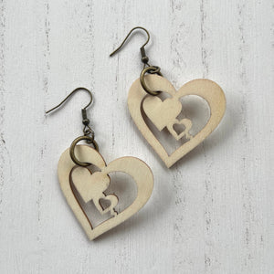 Wooden heart cutouts.  Brass earring wires.