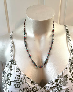 Handcrafted necklace with antique copper chain and components. Beaded with silver hematite, antique copper spacers and cylinders, coral and turquoise dyed howlite stones.  Necklace length is approimatley 25 1/2 inches in length with a lobster clasp fastner.