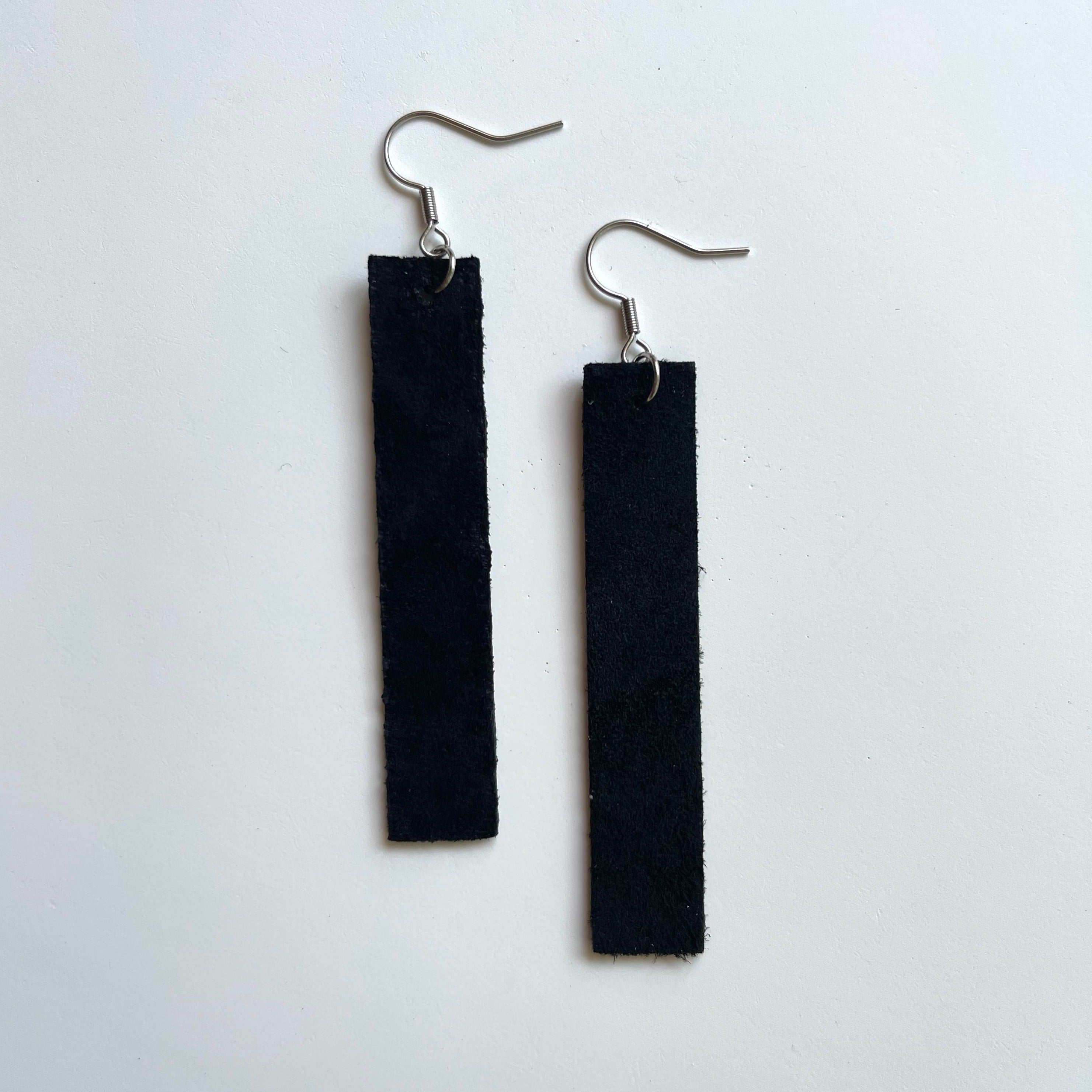 Handcrafted earrings with stainless steel earring wires and components. Suede leather.