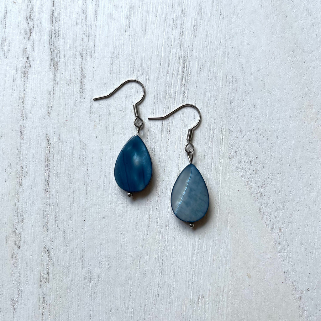 Handcrafted on stainless steel earring wires and components. Blue mother of pearl tear drops.