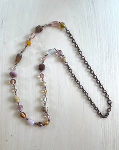 Handcrafted necklace with antique copper. Length is 28.25 inches. Glass beads.