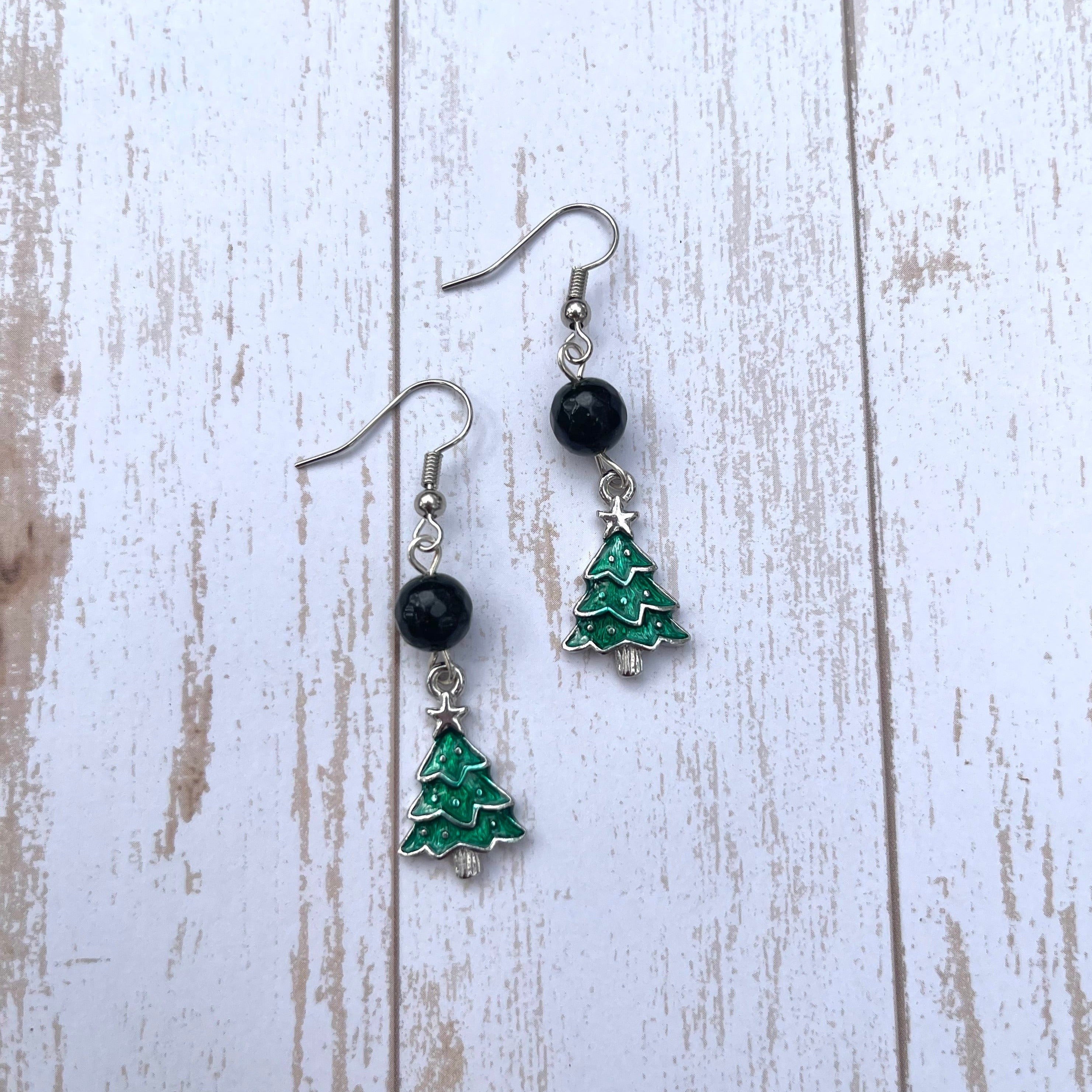 Handcrafted on silver plated earring wires. Pewter Christmas charms with enamel. Green goldstone beads.