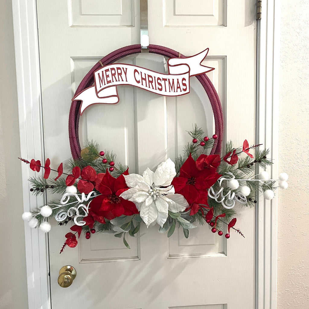 Handcrafted Christmas wreath on an upcycled lariat roping rope. Florals and metal sign. Width of rope: 21 1/2 inches. Width with décor: Approximately 34 inches.