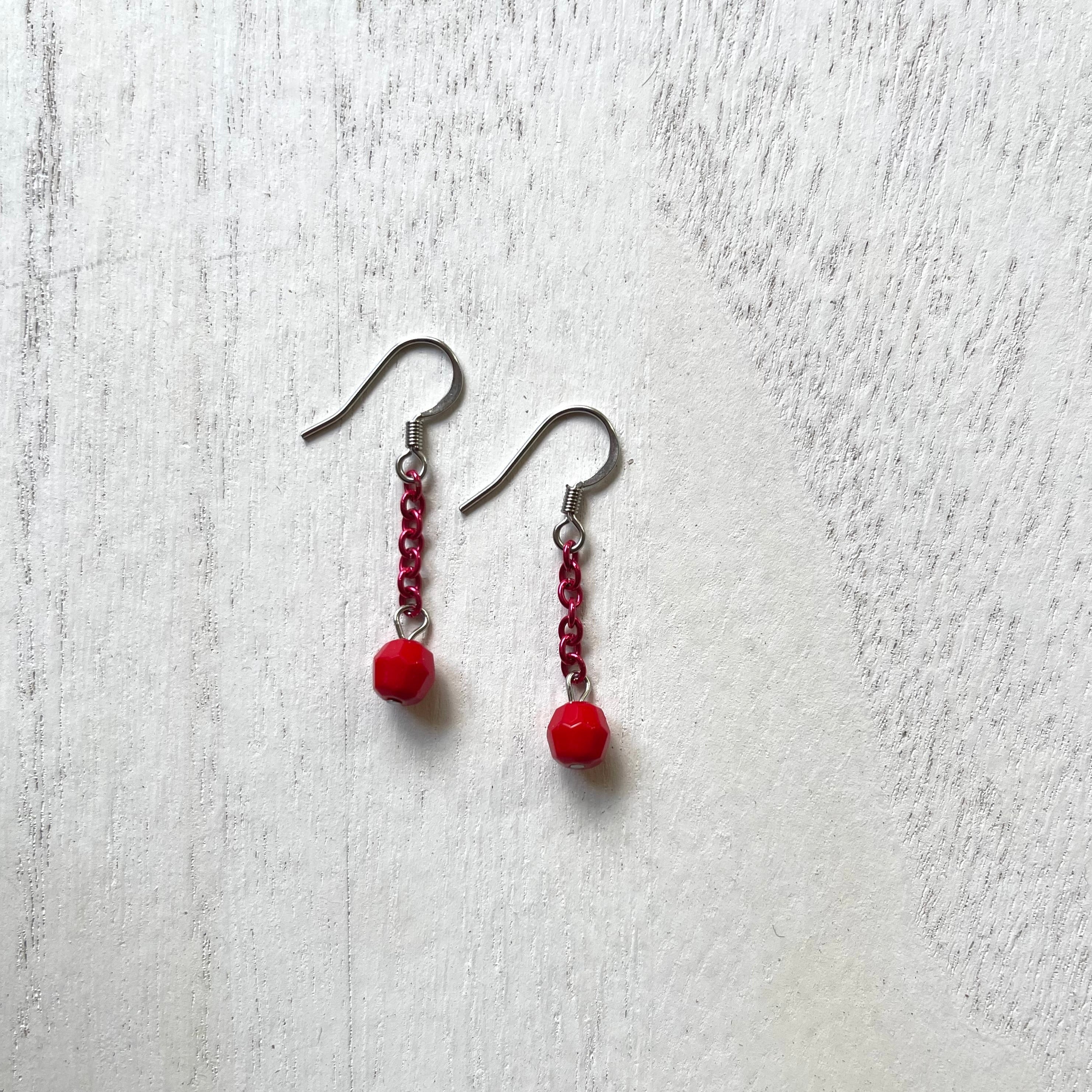 Handcrafted earrings with stainless steel earring wires.  Aluminum chain and glass beads.