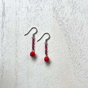 Handcrafted earrings with stainless steel earring wires.  Aluminum chain and glass beads.