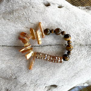 Handcrafted stretch bracelet on professional Ninja Stretch Cord. Beaded with quartz sticks, citrine, tiger eye, and amber glass luster rondelles.