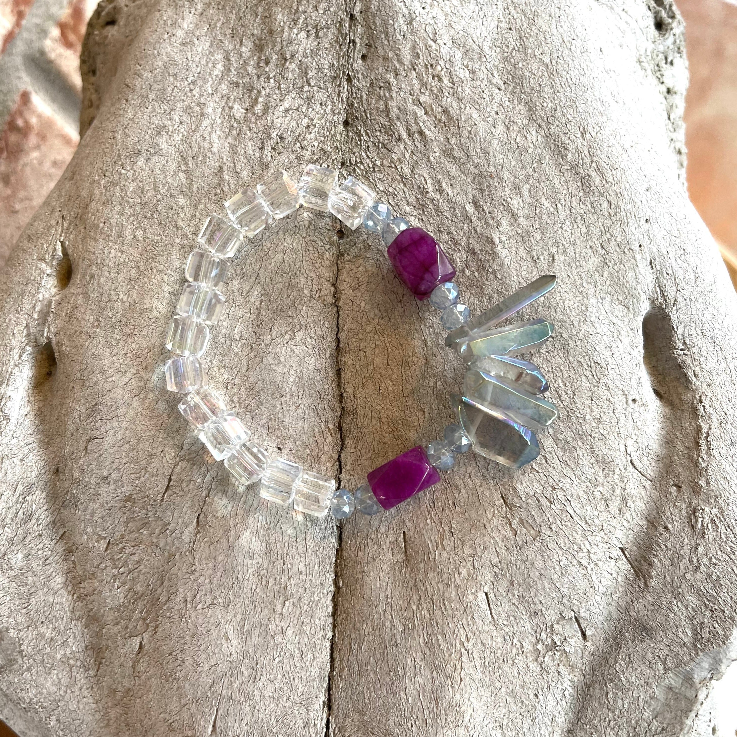 Handcrafted stretch bracelet on professional Ninja Stretch Cord. Beaded with clear crystal cubes, light blue crystal rondelles, quartz sticks, and purple agate stones.