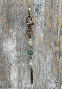 Handcrafted with an antique copper swivel lobster clasp.  Antique copper tassel and components.  Green glass beads with Czech glass seed beads to accent. 