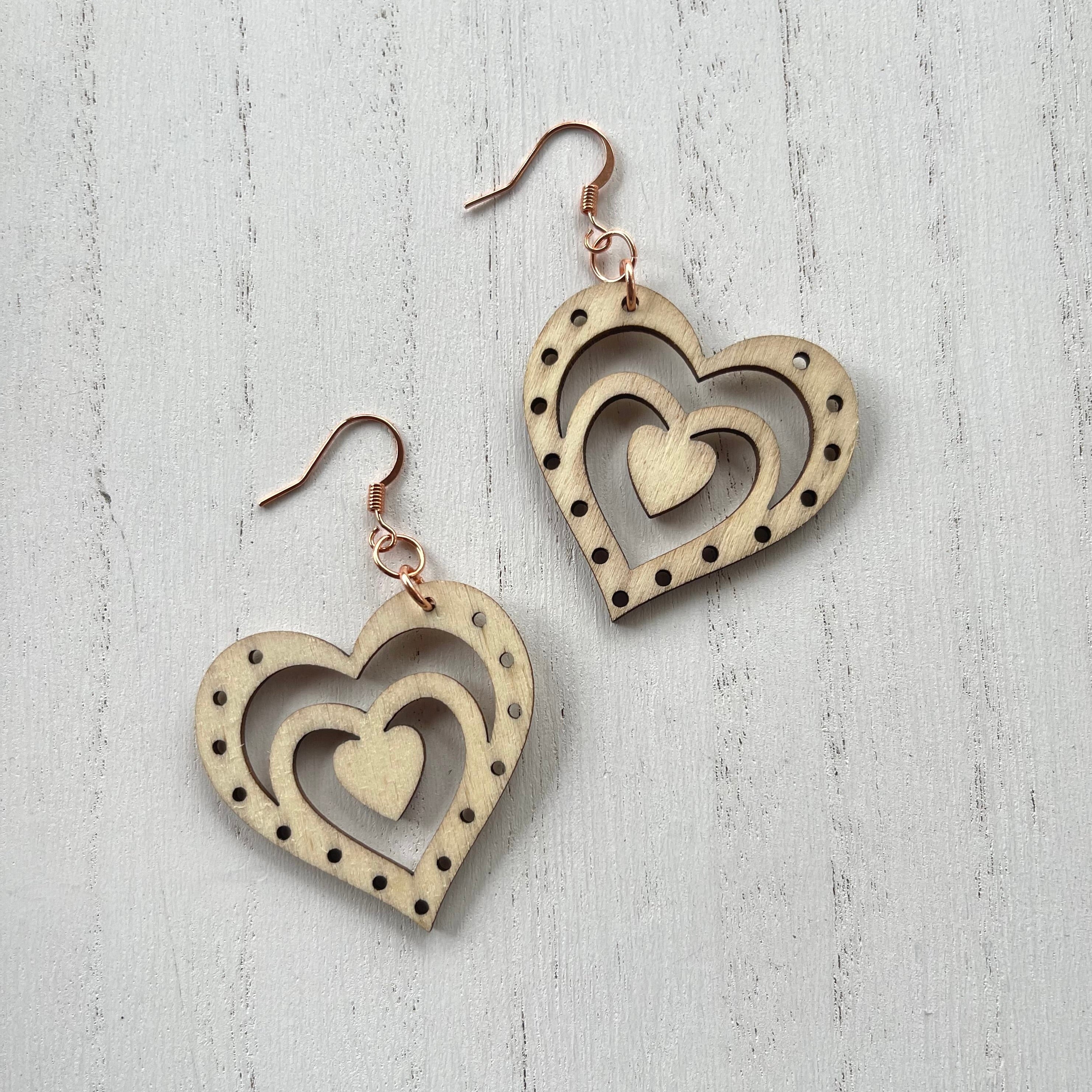 Wooden heart cutouts.  Copper earring wires. 