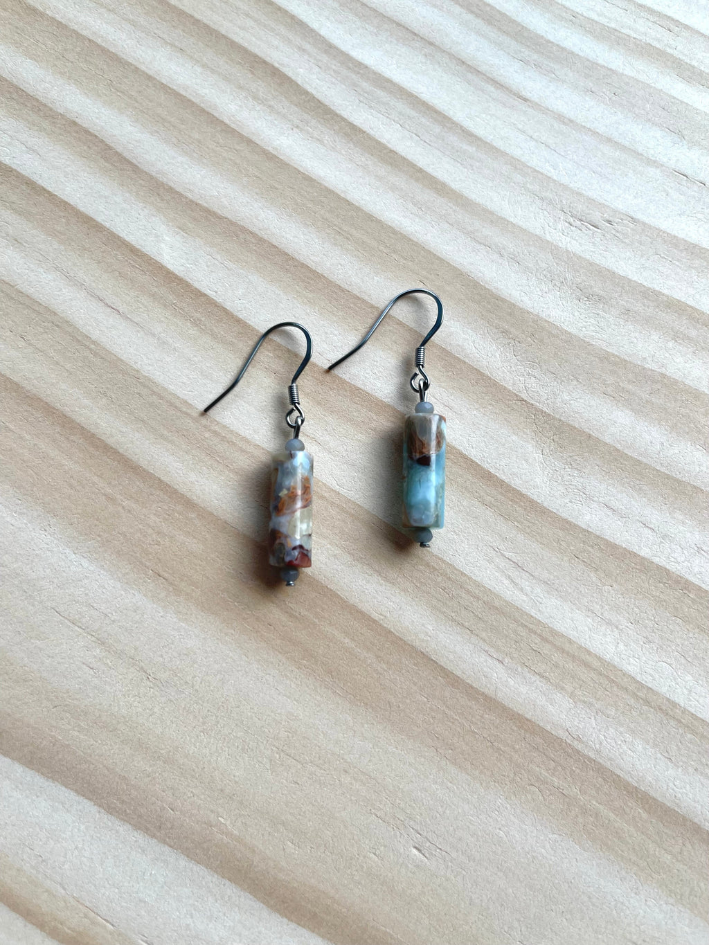 Handcrafted earrings on stainless steel earring wires. Stainless steel components. Jasper stones with crystal accents.