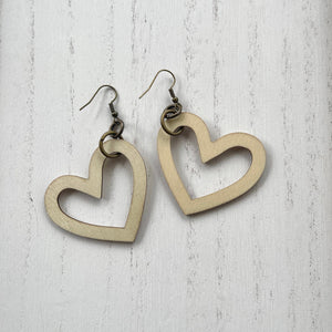 Wooden heart cutouts.  Brass earring wires.