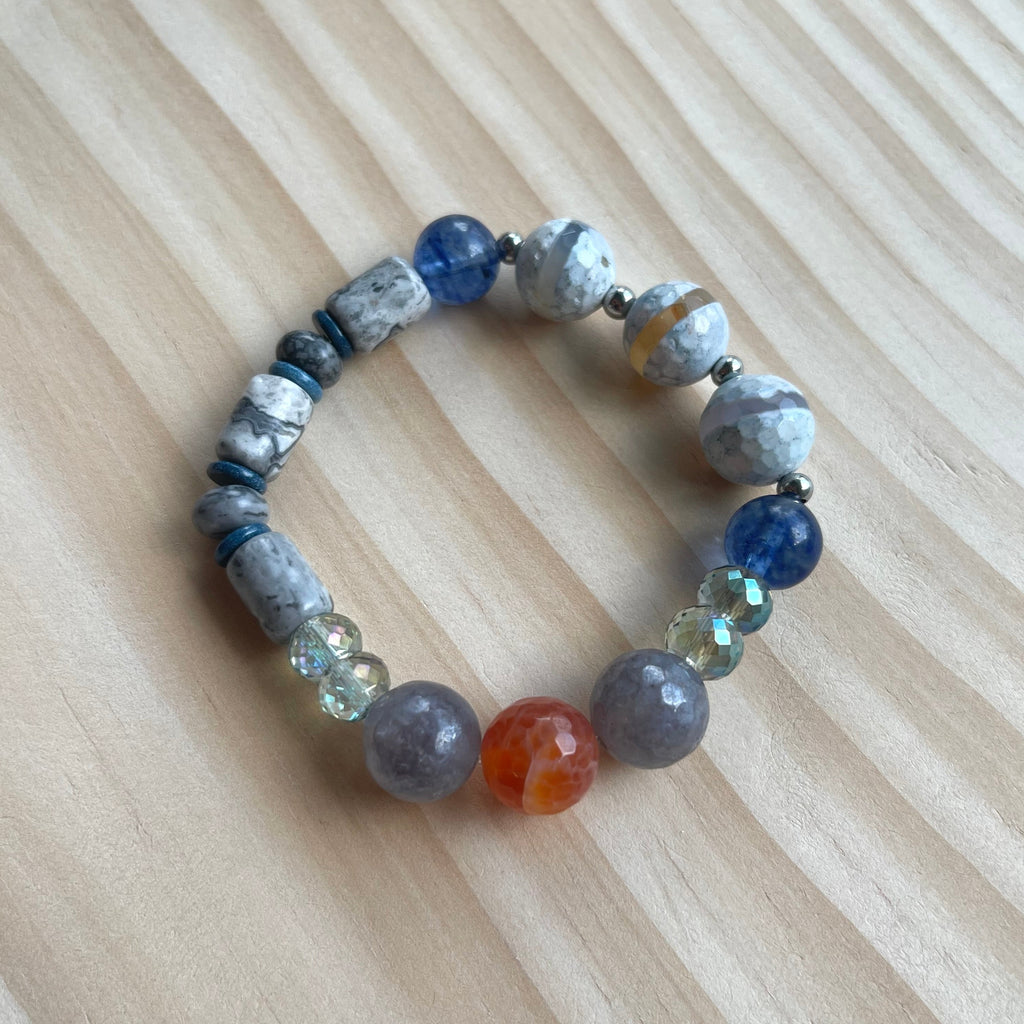 Handcrafted stretch bracelet on professional Ninja Stretch Cord. Beaded with cloudy quartz, carnelian agate, glass, snow jade, wave jasper, agate, blueberry quartz, and stainless steel.