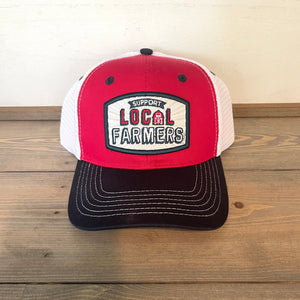 Men's Farm Boy support local farmers cap. One size fits most. Mesh back. Adjustable snapback closure. Red, white, and blue. White tractor under the bill.