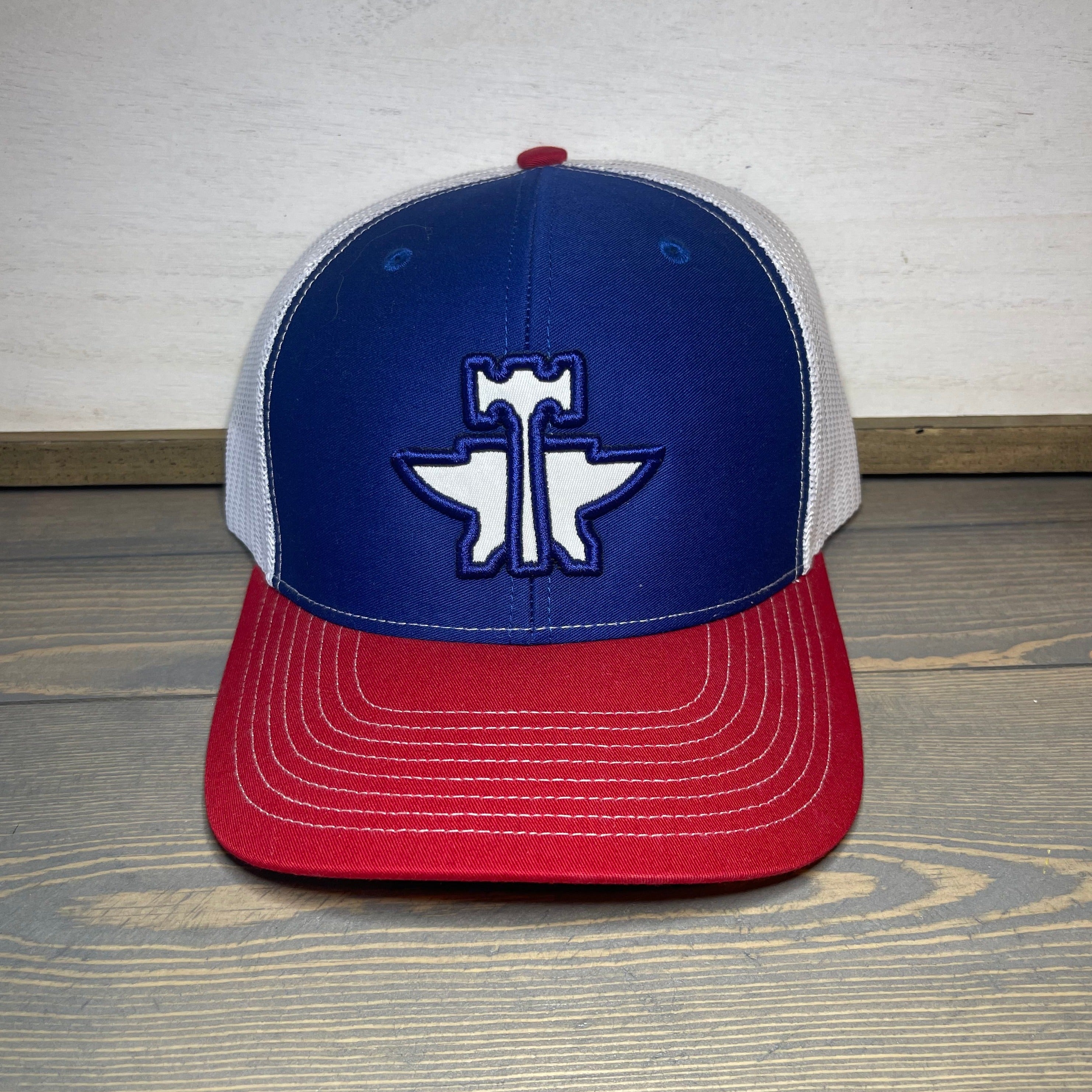 Men's Tin Haul Trucker Logo Cap. One size fits most. Mesh back. Adjustable snapback closure. Red/White/Blue.