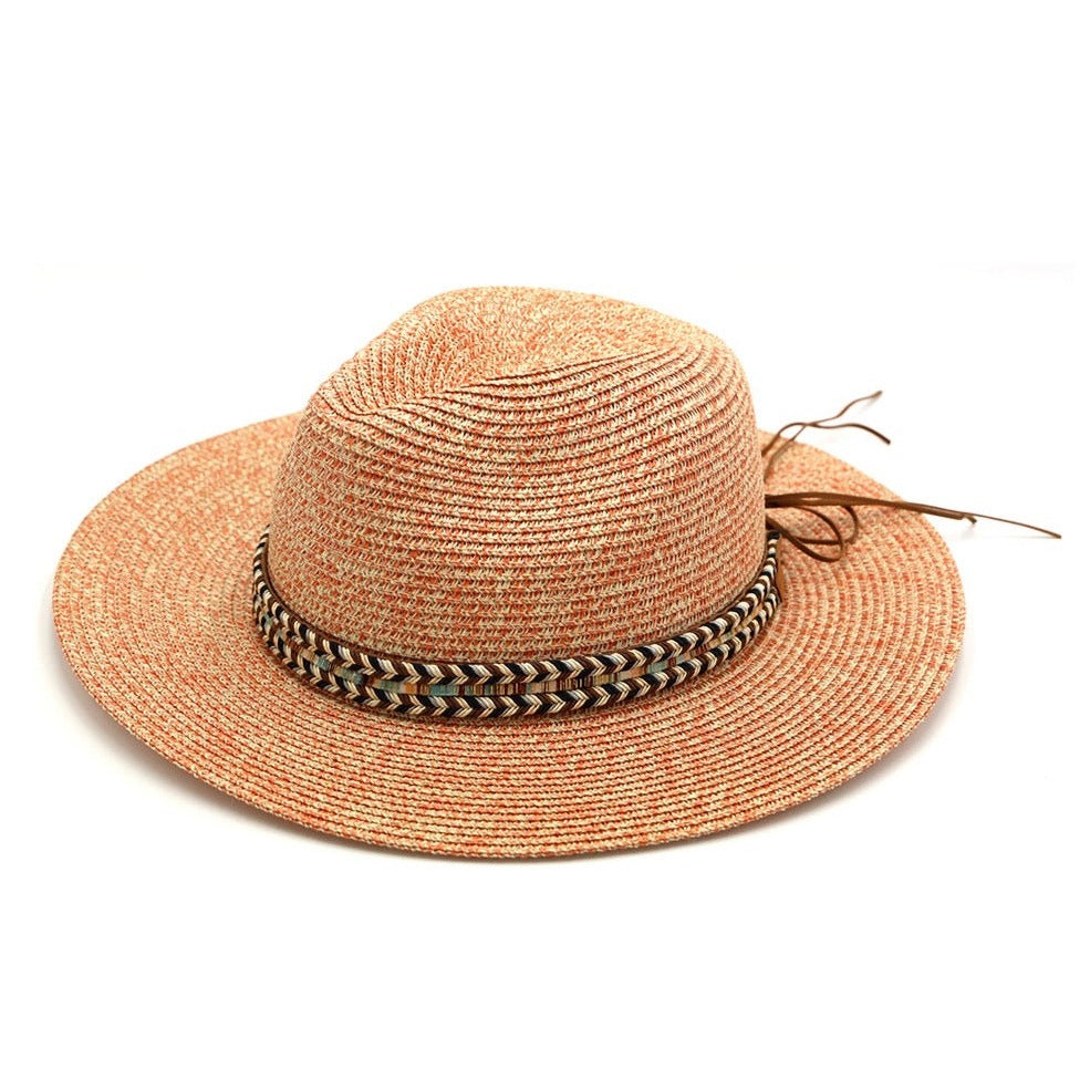 100% paper straw. Multi colored braided and striped fabric band with faux leather bow. 14.5" x 14". 3" Brim. Approx. 23" circumference. Sweatband. One size fits most. Do not wash, tumble dry, or iron.