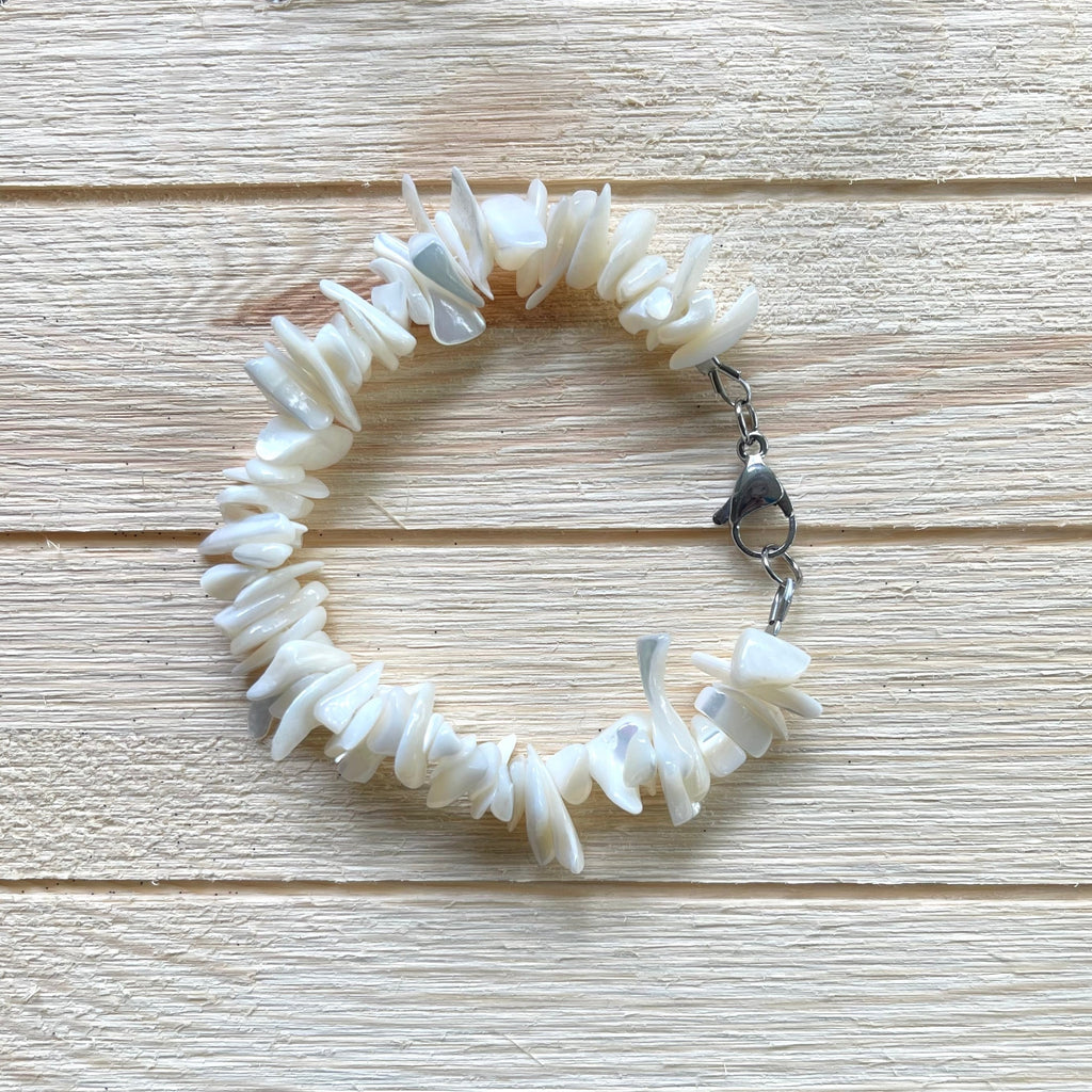 Bracelet is 7 1/2 inches long. Handcrafted with chunky rivershell chip beads. Has larger 15mm stainless steel lobster clasp for easier clasping.  Stainless steel components. 