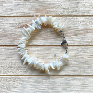 Bracelet is 7 1/2 inches long. Handcrafted with chunky rivershell chip beads. Has larger 15mm stainless steel lobster clasp for easier clasping.  Stainless steel components. 