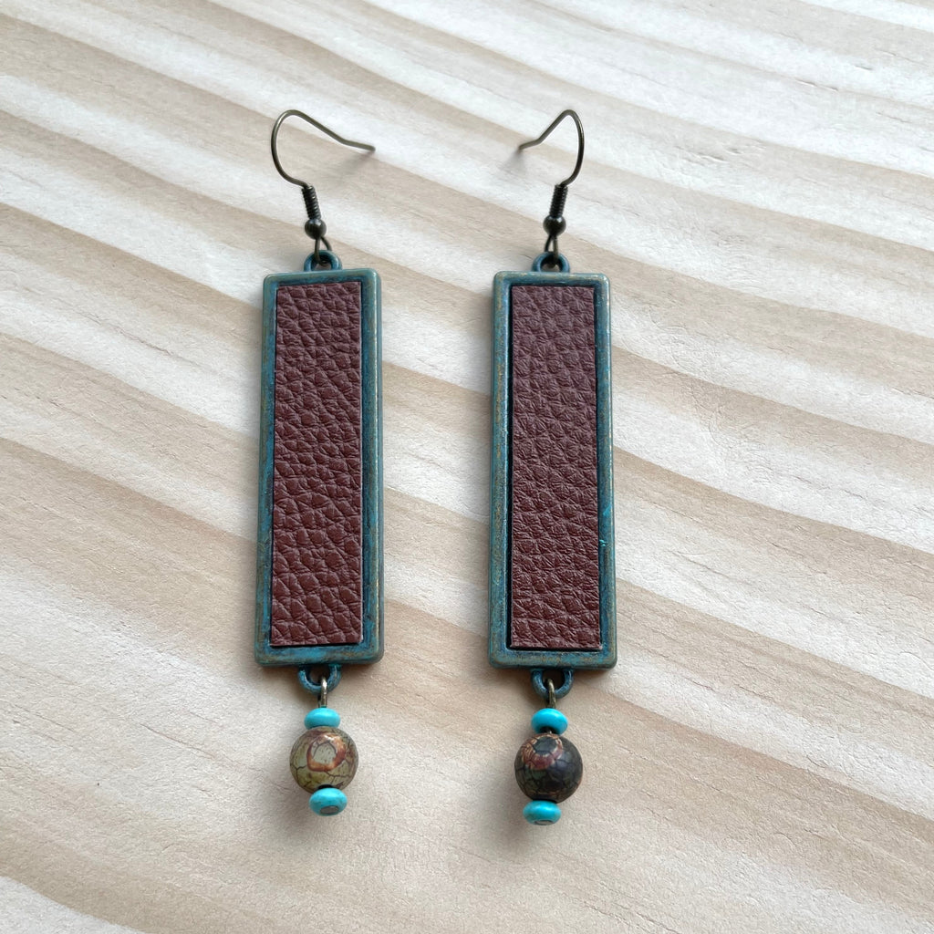 Handcrafted earrings with brass earring wires. Brass pendants with leather. Agate stones with howlite accents.