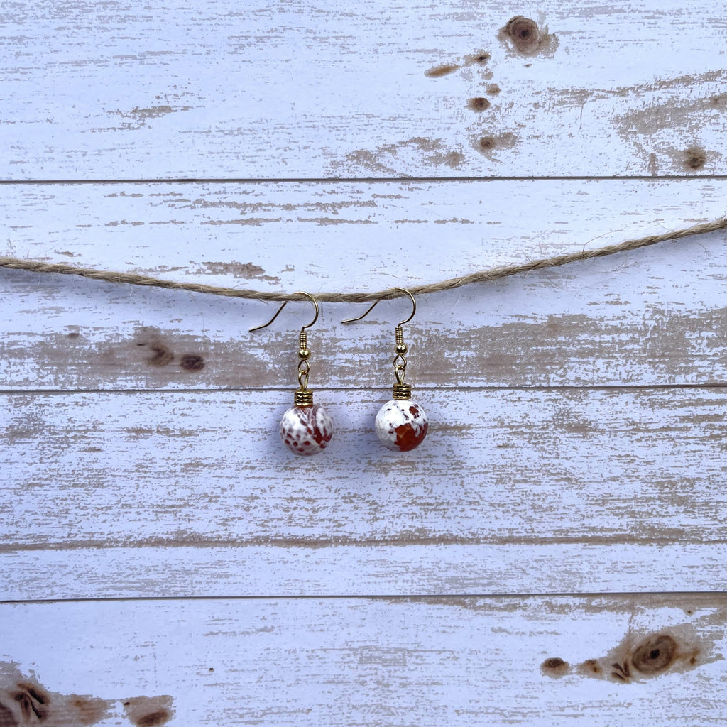 Handcrafted on 18k gold plated earring wires. 10mm carnelian agate faced stone.  Gold accent bead.