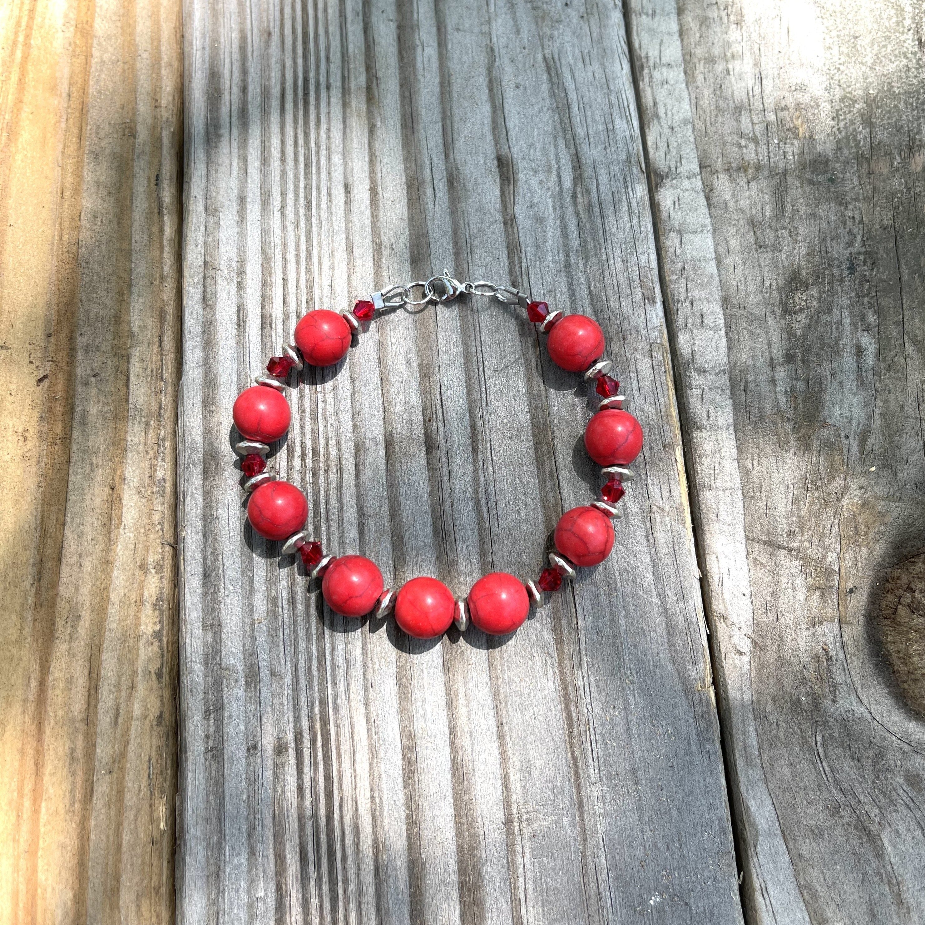 Length is 7 1/2 inches. Handcrafted with red dyed howlite stones, red czech glass bicone beads, and silver plated rondel spacers.  All metal is stainless steel and pewter.