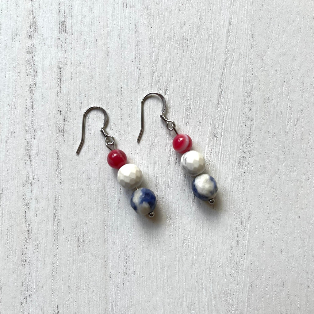 Handcrafted earrings with stainless steel earring wires and components. Beaded with striated agate, howlite, and sodalite stones.