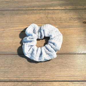 Cotton textured hair scrunchie is pale blue.