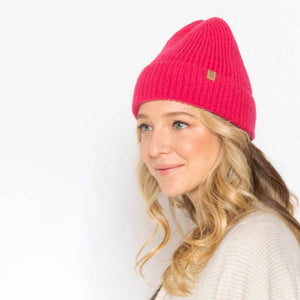 Solid Color Knit Beanie. One Size Fits Most. 100% Acrylic. Roll-up Brim. Care: Machine Washable.