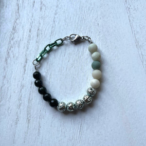 Handcrafted bracelet with stainless steel clasp, and aluminum chain. Beaded with amazonite, lava stone, and green sandstones.  Approximately 7 1/2 inches in length.