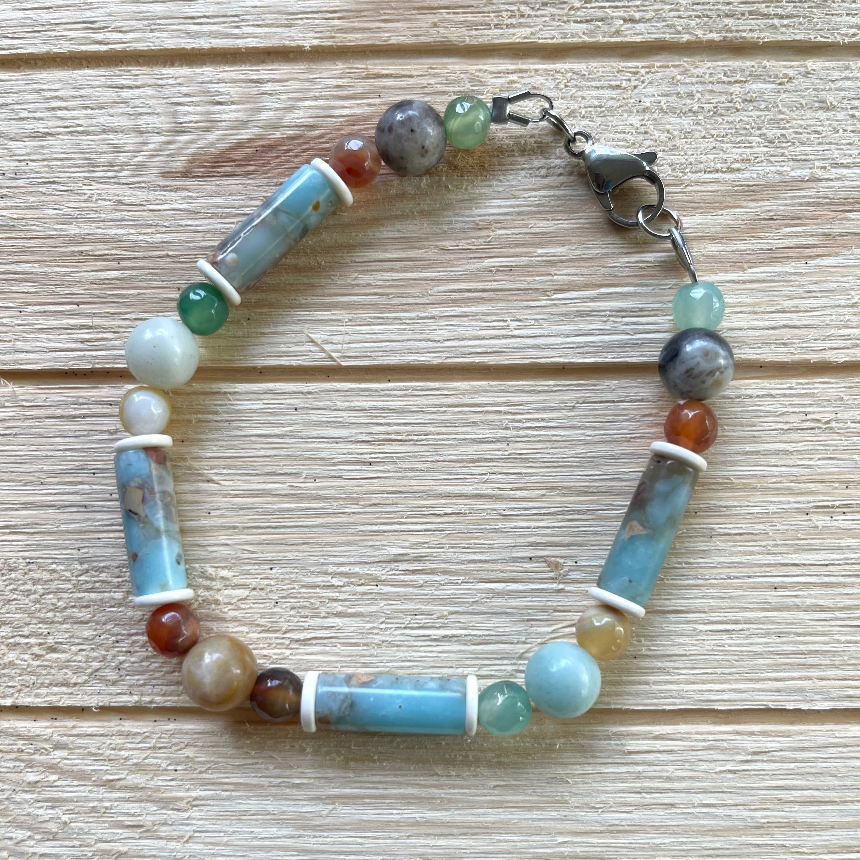 Handcrafted bracelet. Length: 8 1/2 inches. Stainless steel clasp, components. Jasper, snow jade, agate, and amazonite. 